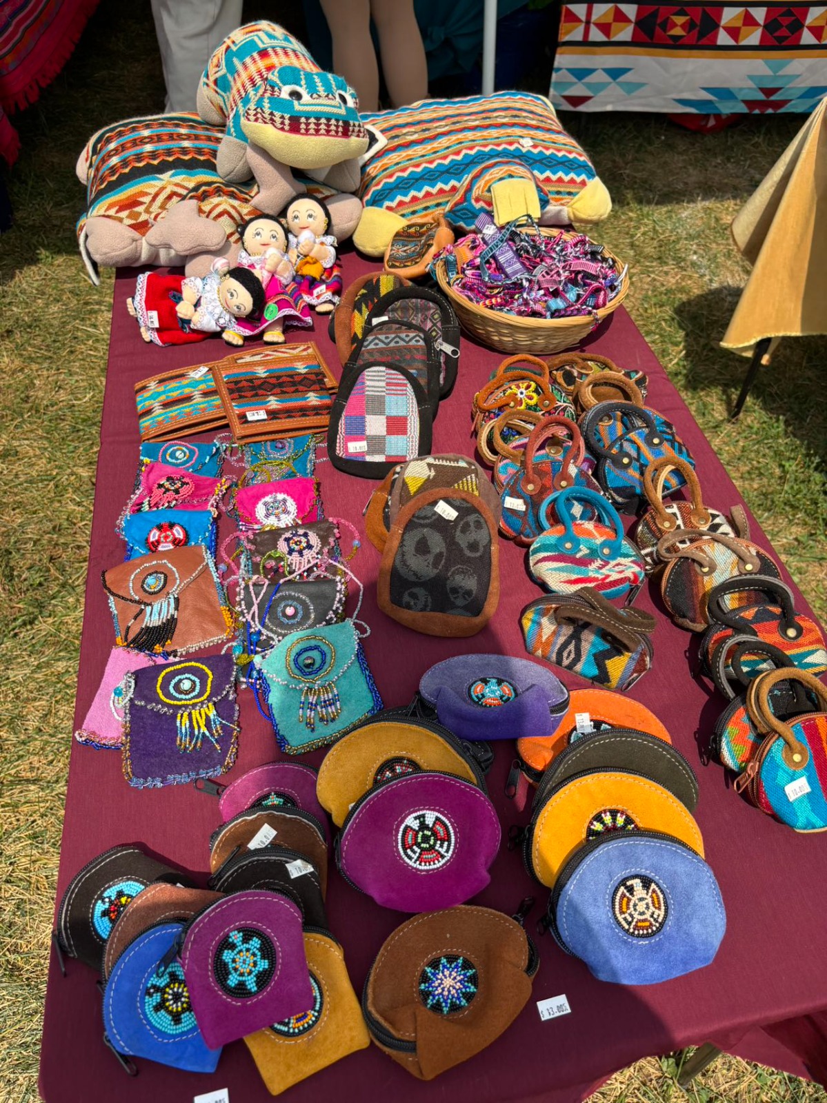 Dreamcatcher vendor booth with handmade dreamcatchers, beaded jewelry, and advocacy shirts