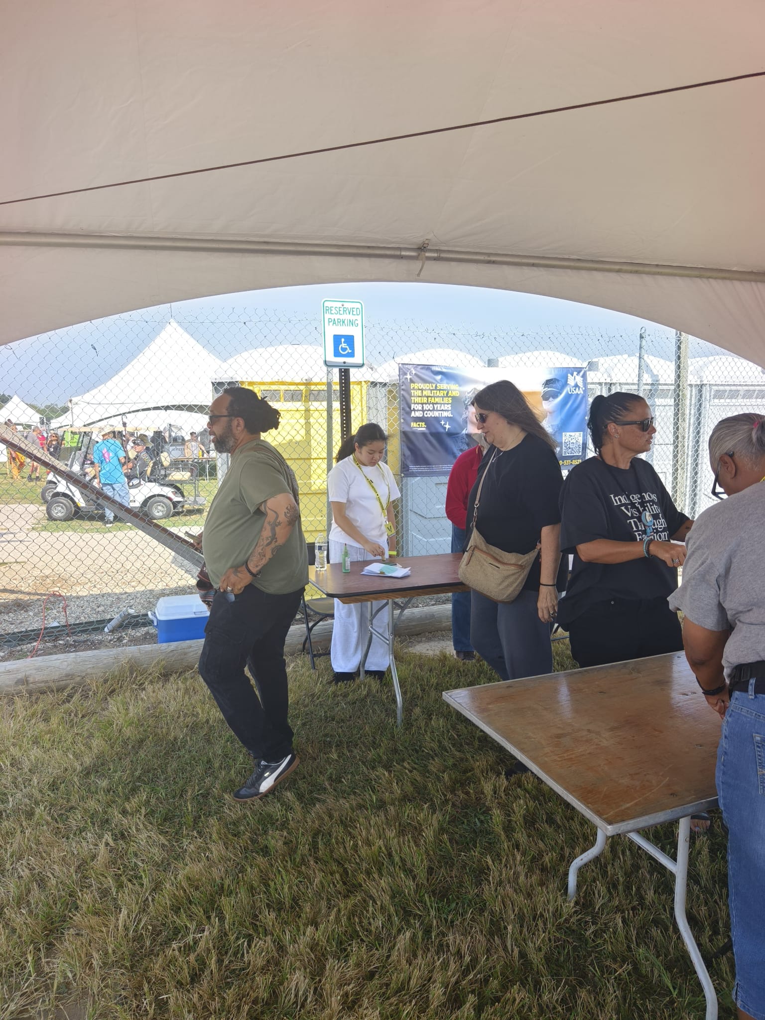 Vivian interacting with PowWow visitors and elders
